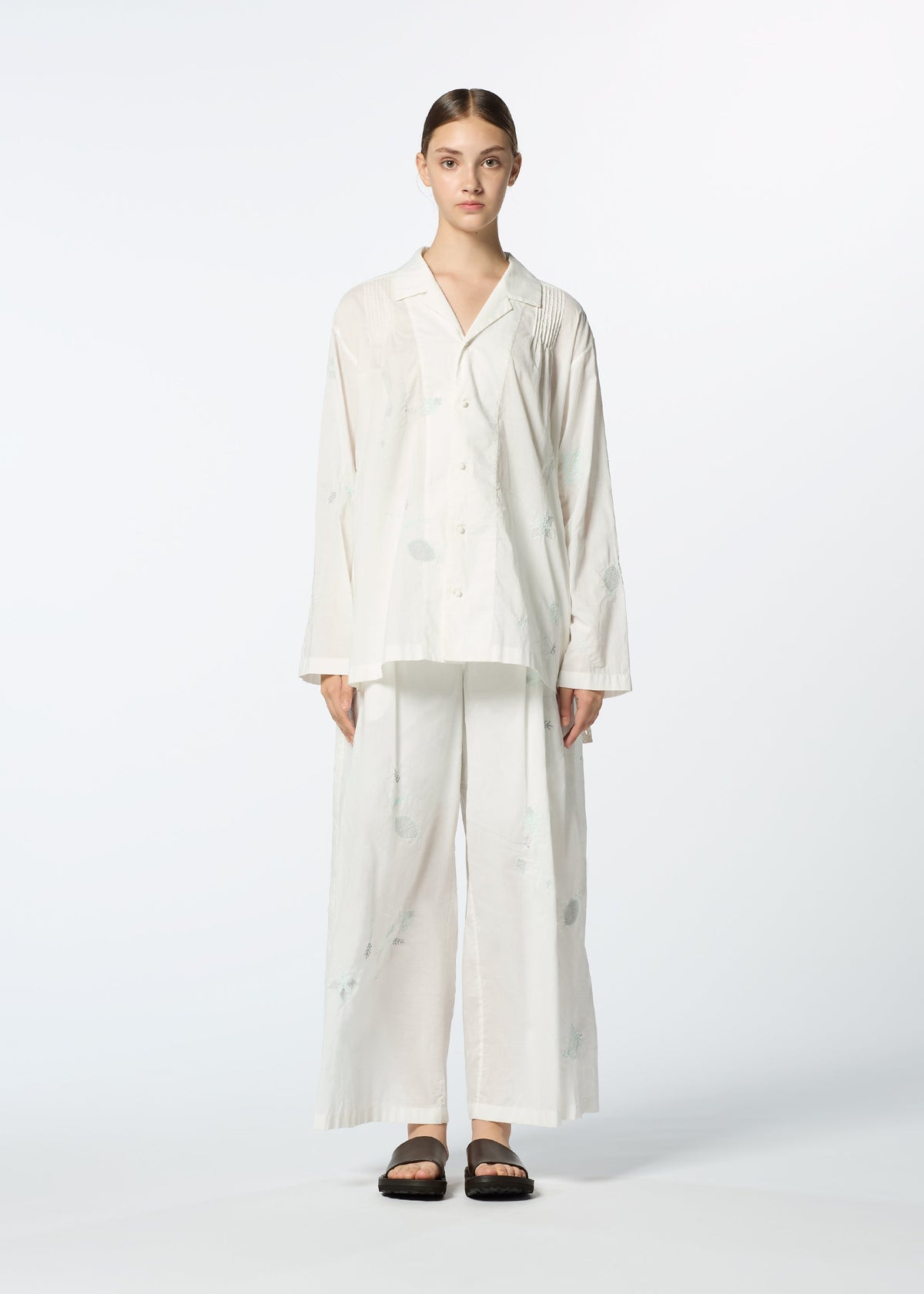 A model wears the HAAT DAMI LEAVES trousers.