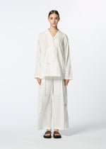 A model wears the HAAT DAMI LEAVES trousers.