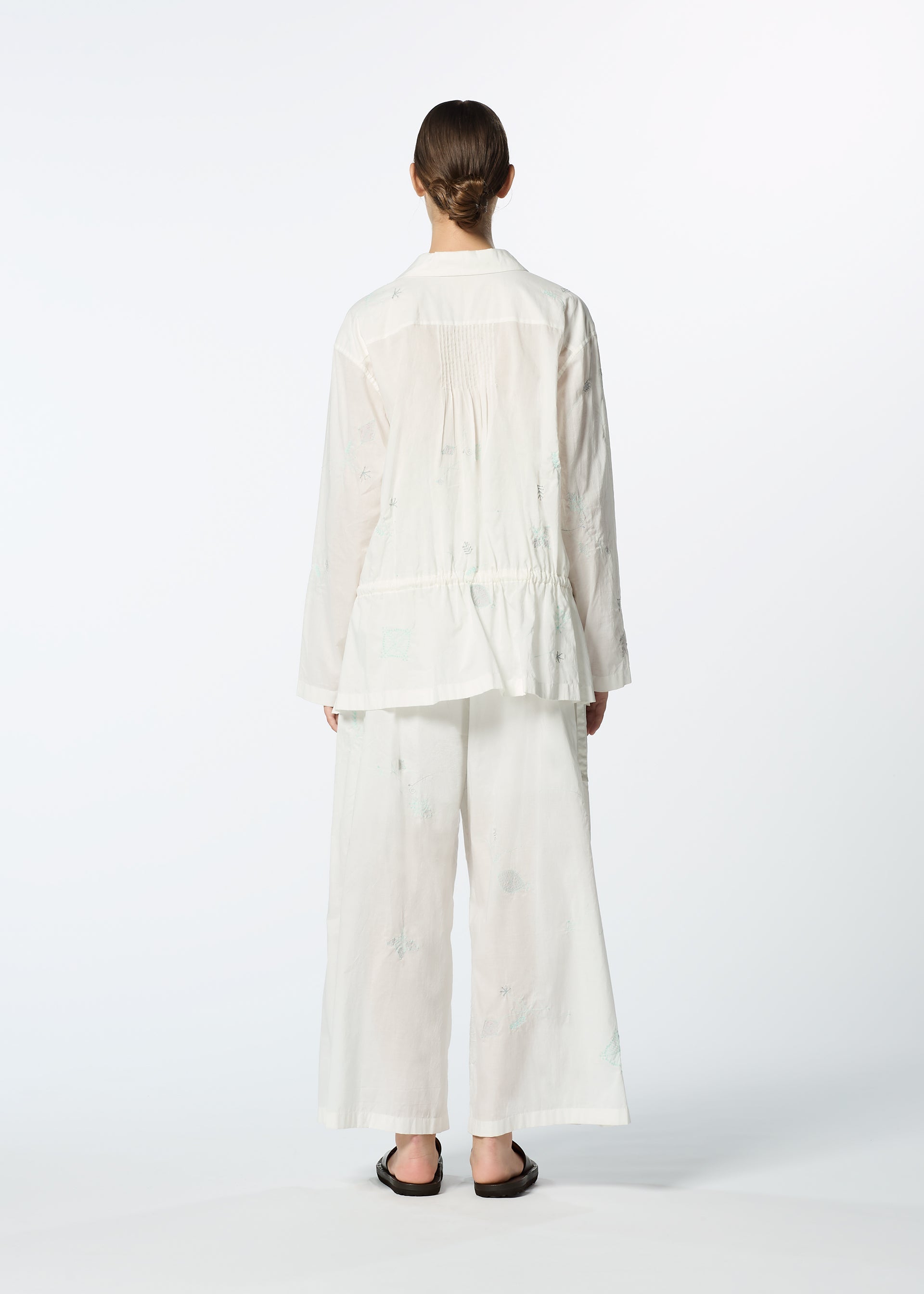 A model wears the HAAT DAMI LEAVES trousers.