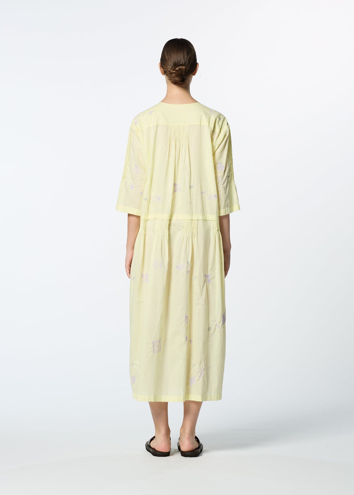 A model wears the HAAT DAMI LEAVES dress.
