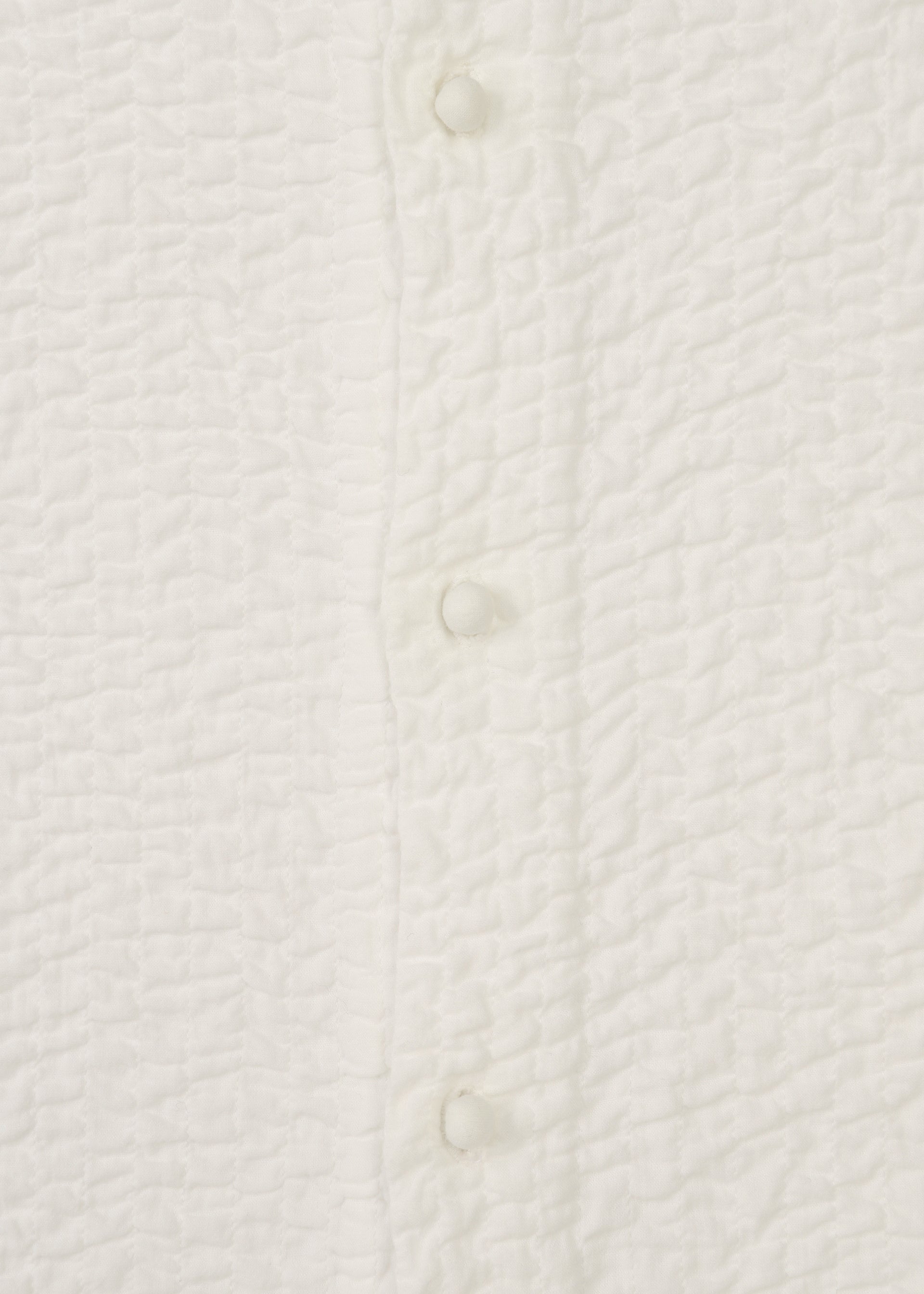 A detail shot of the HAAT 3 MUL MACHINE KABIRA '26SS clothing.