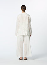 A model wears the HAAT DAMI LEAVES shirt.