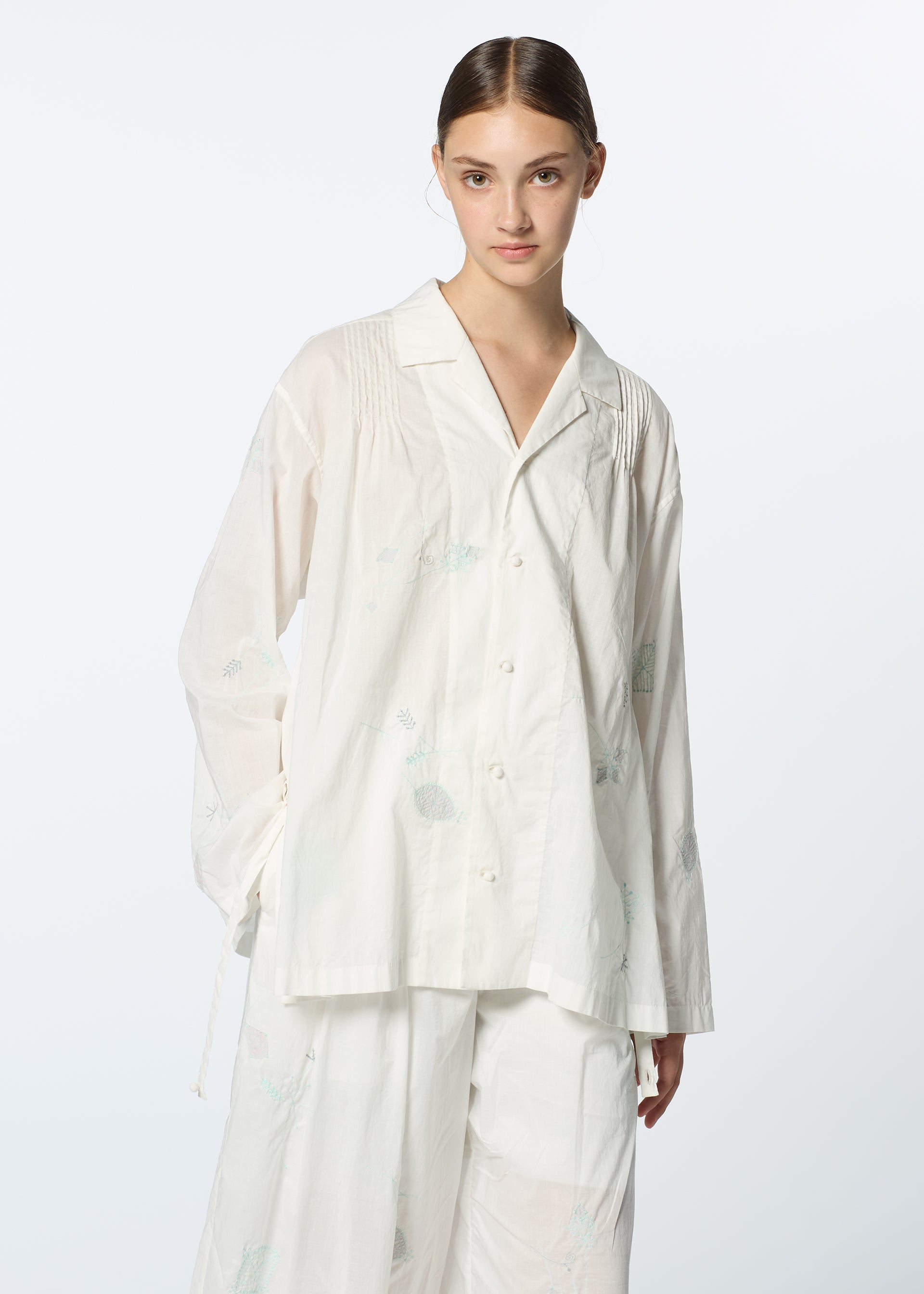 A model wears the HAAT DAMI LEAVES shirt.