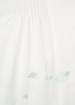 A detail shot of the HAAT DAMI LEAVES shirt.