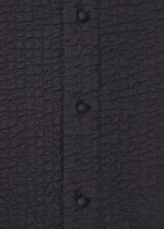 A detail shot of the HAAT 3 MUL MACHINE KABIRA '26SS clothing.