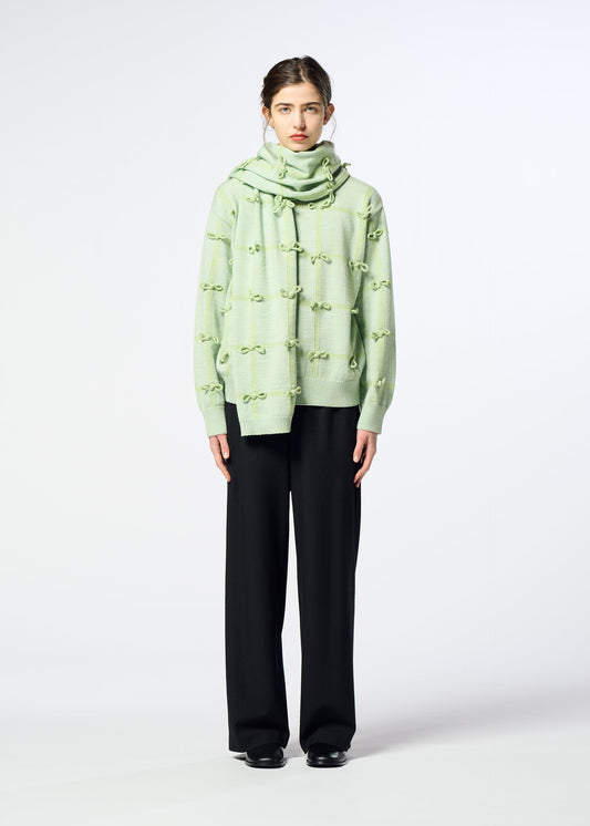 A model wears the HaaT RIBBON KNIT ribbon-knit-stole-grey.