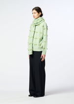 A model wears the HaaT RIBBON KNIT ribbon-knit-stole-grey.
