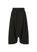 A product shot of the HaaT SAKIORI trousers in black.
