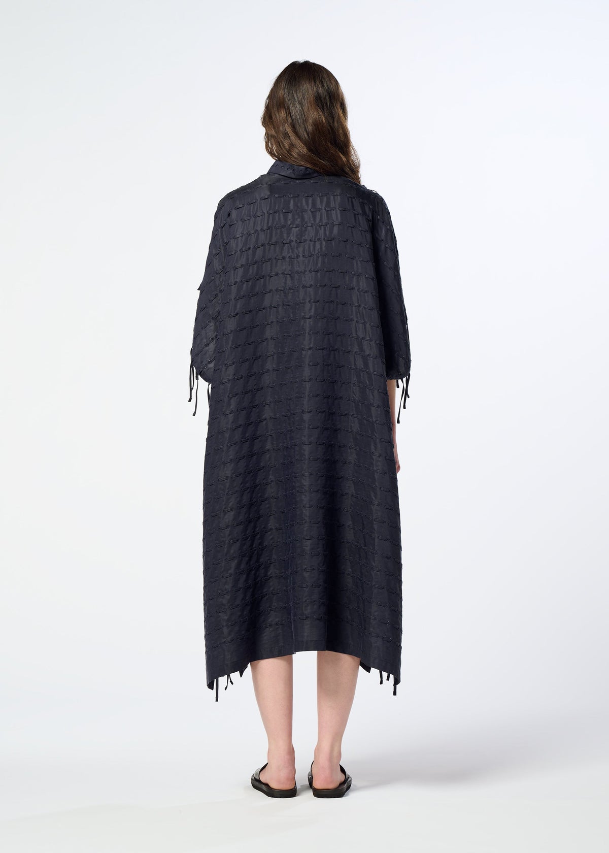 A model wears the HaaT HOLE & LINE hole-line-dress-navy.