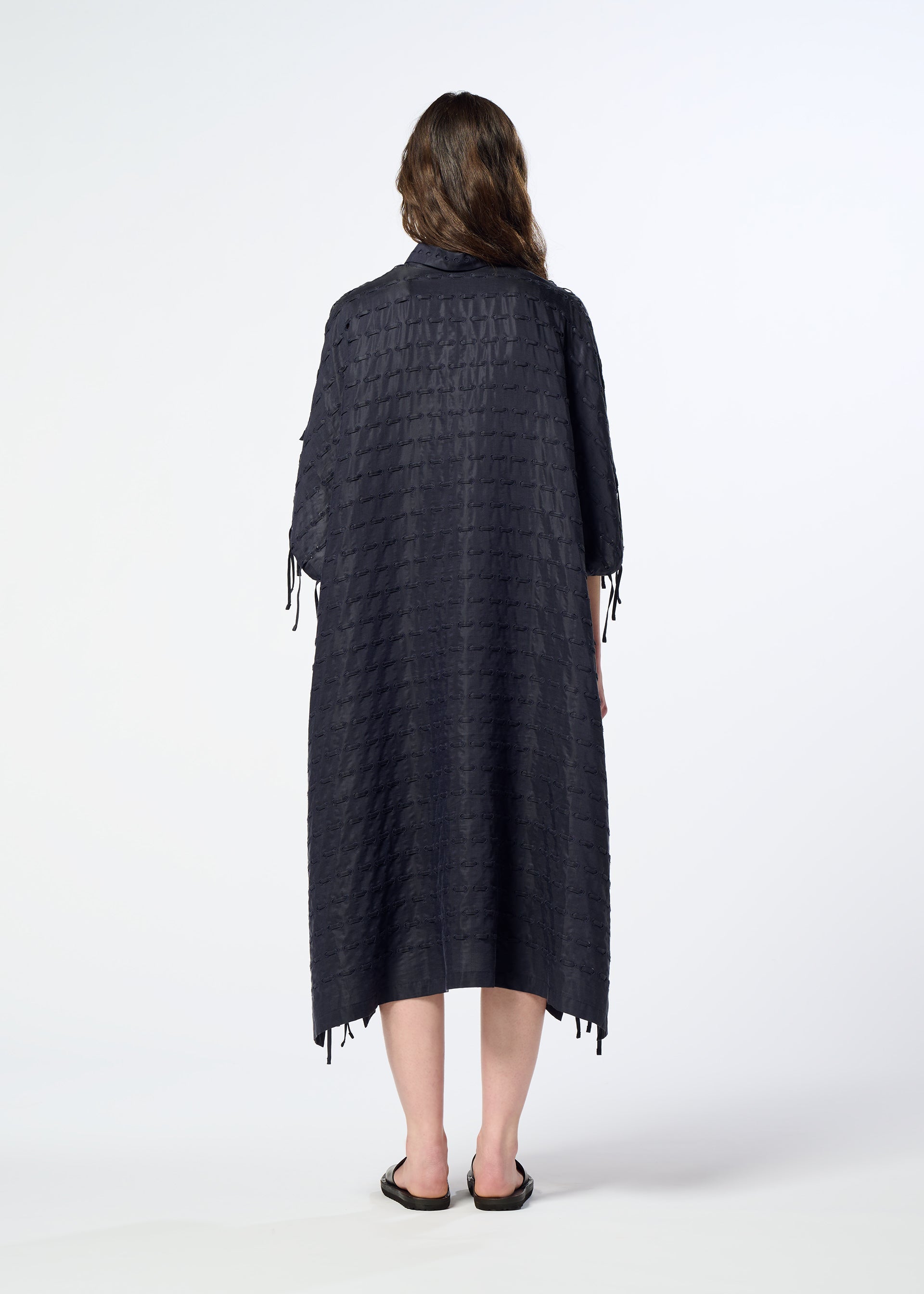 A model wears the HaaT HOLE & LINE hole-line-dress-navy.