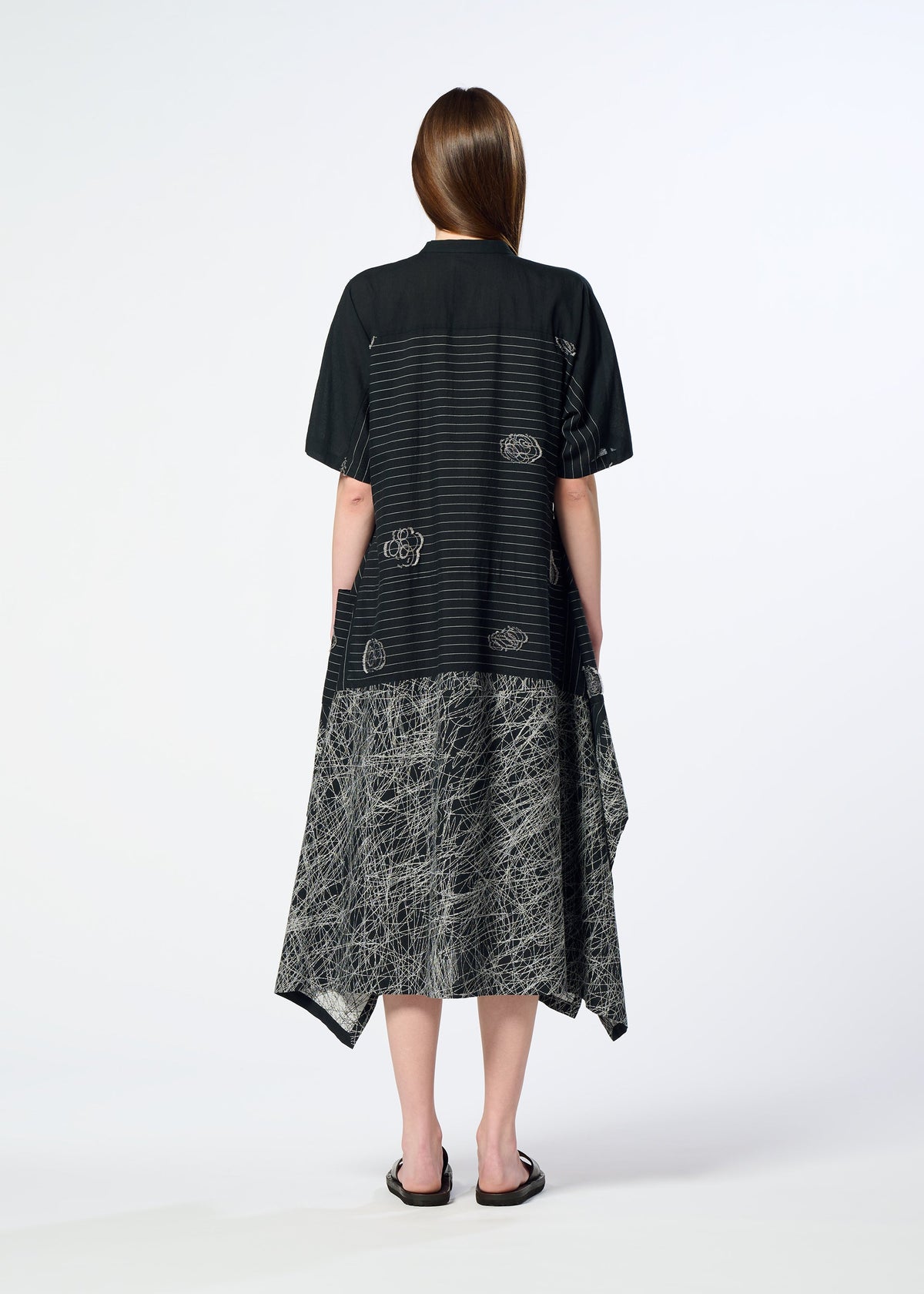 A model wears the HaaT ONE STROKE DRAW dress.