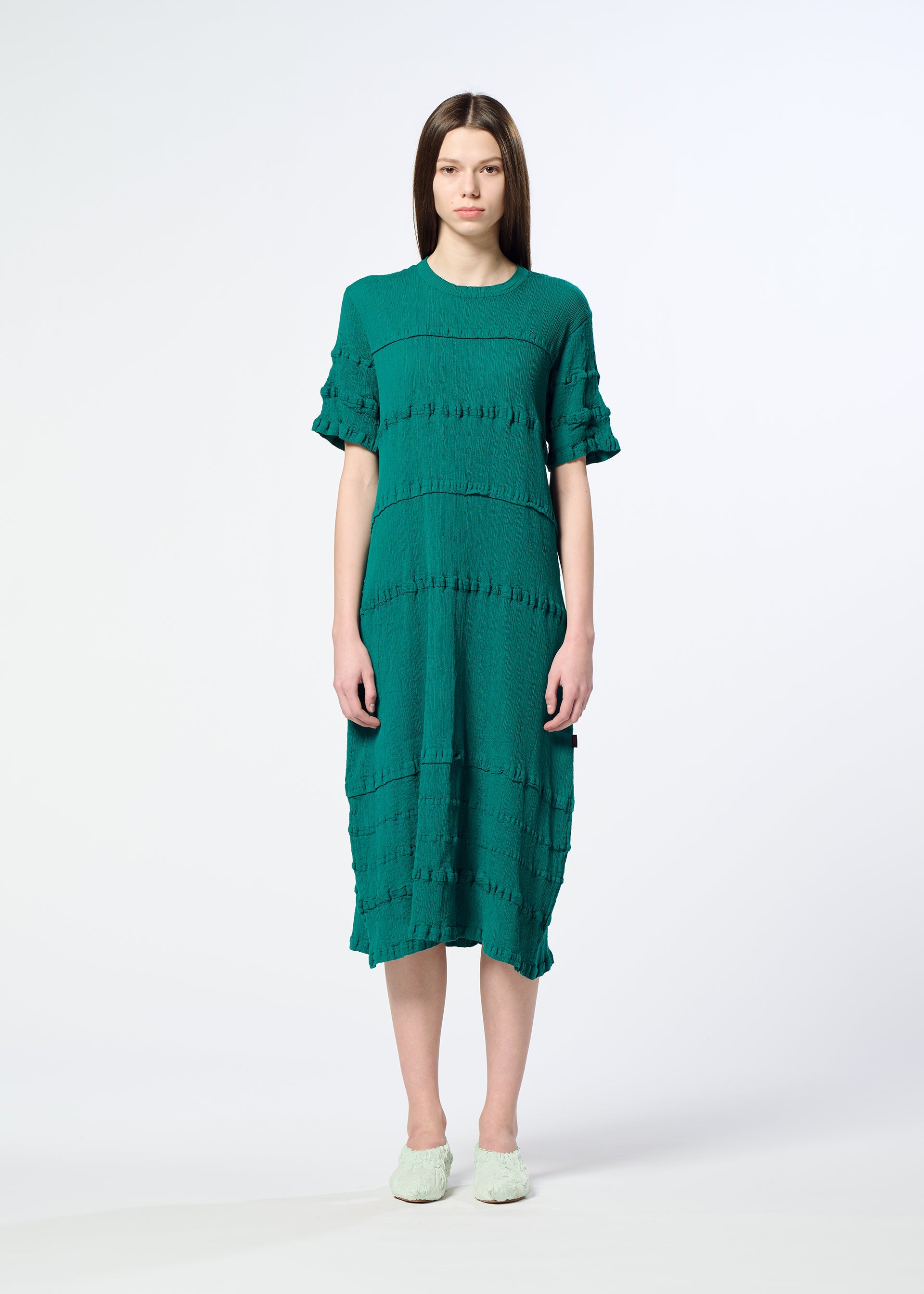 A model wears the HaaT KYO CHIJIMI TSUCHIKABE dress.