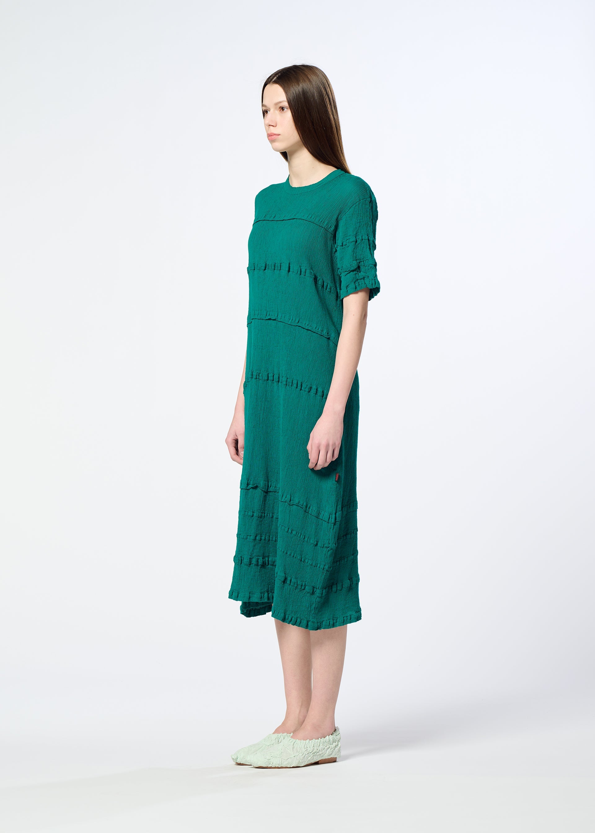 A model wears the HaaT KYO CHIJIMI TSUCHIKABE dress.