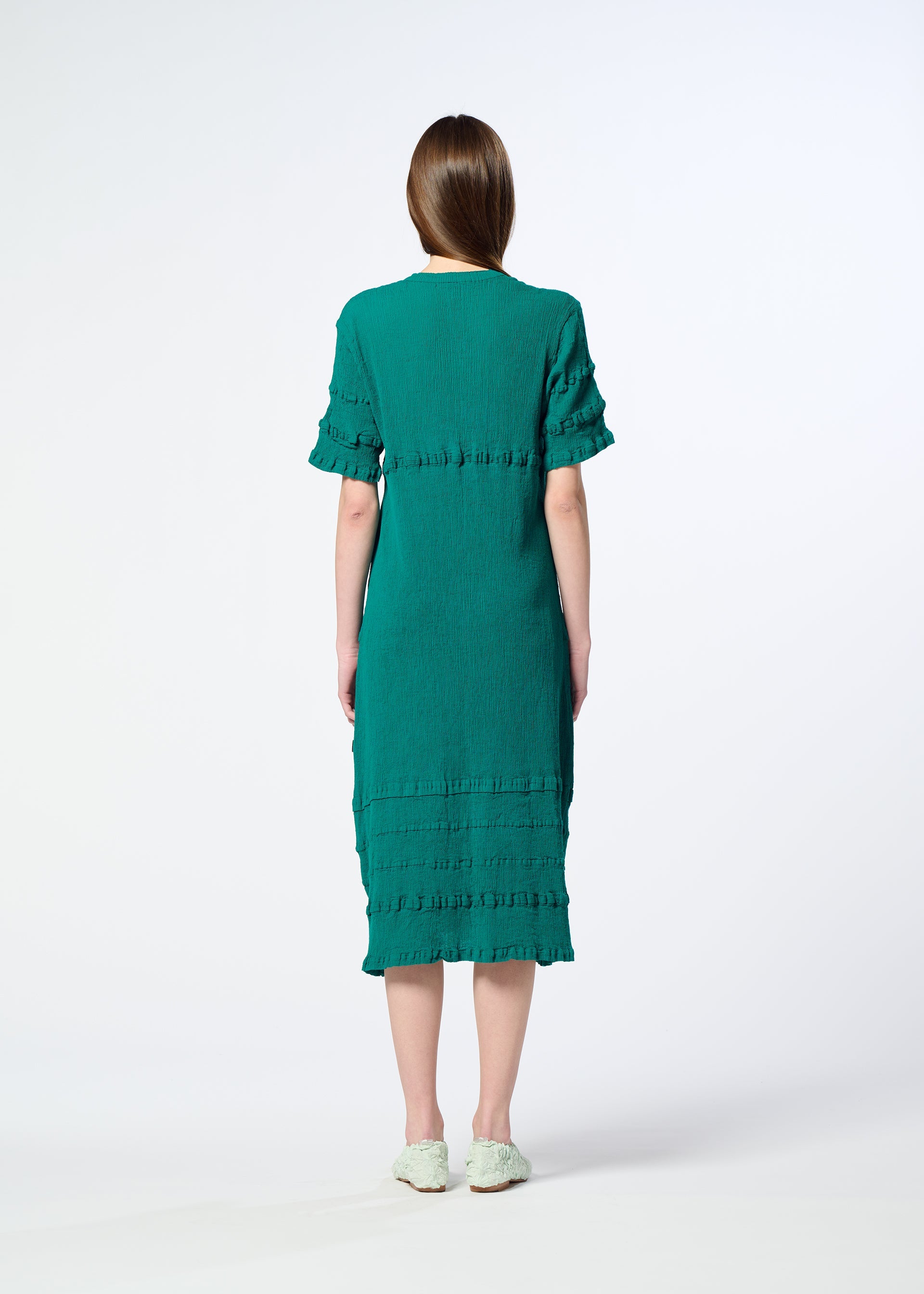 A model wears the HaaT KYO CHIJIMI TSUCHIKABE dress.