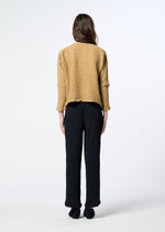 A model wears the HaaT KYO CHIJIMI 2WAY kyo-chijimi-2way-top-brownish-black.