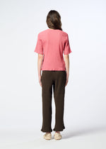 A model wears the HaaT KYO CHIJIMI AUGUST kyo-chijimi-august-top-coral.