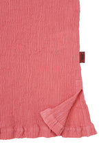 A detail shot of the HaaT KYO CHIJIMI AUGUST top.