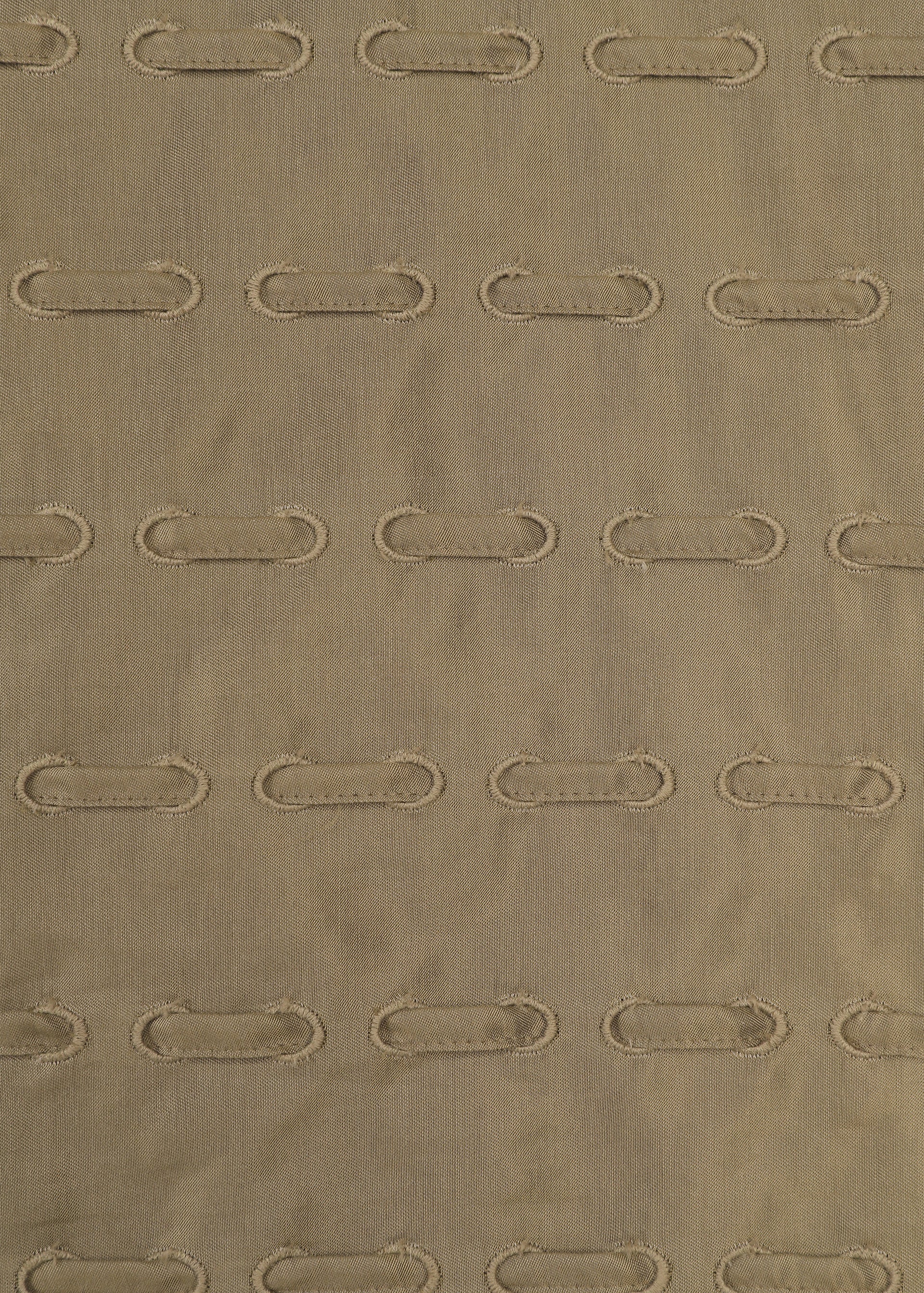 A detail shot of the HaaT HOLE & LINE top.