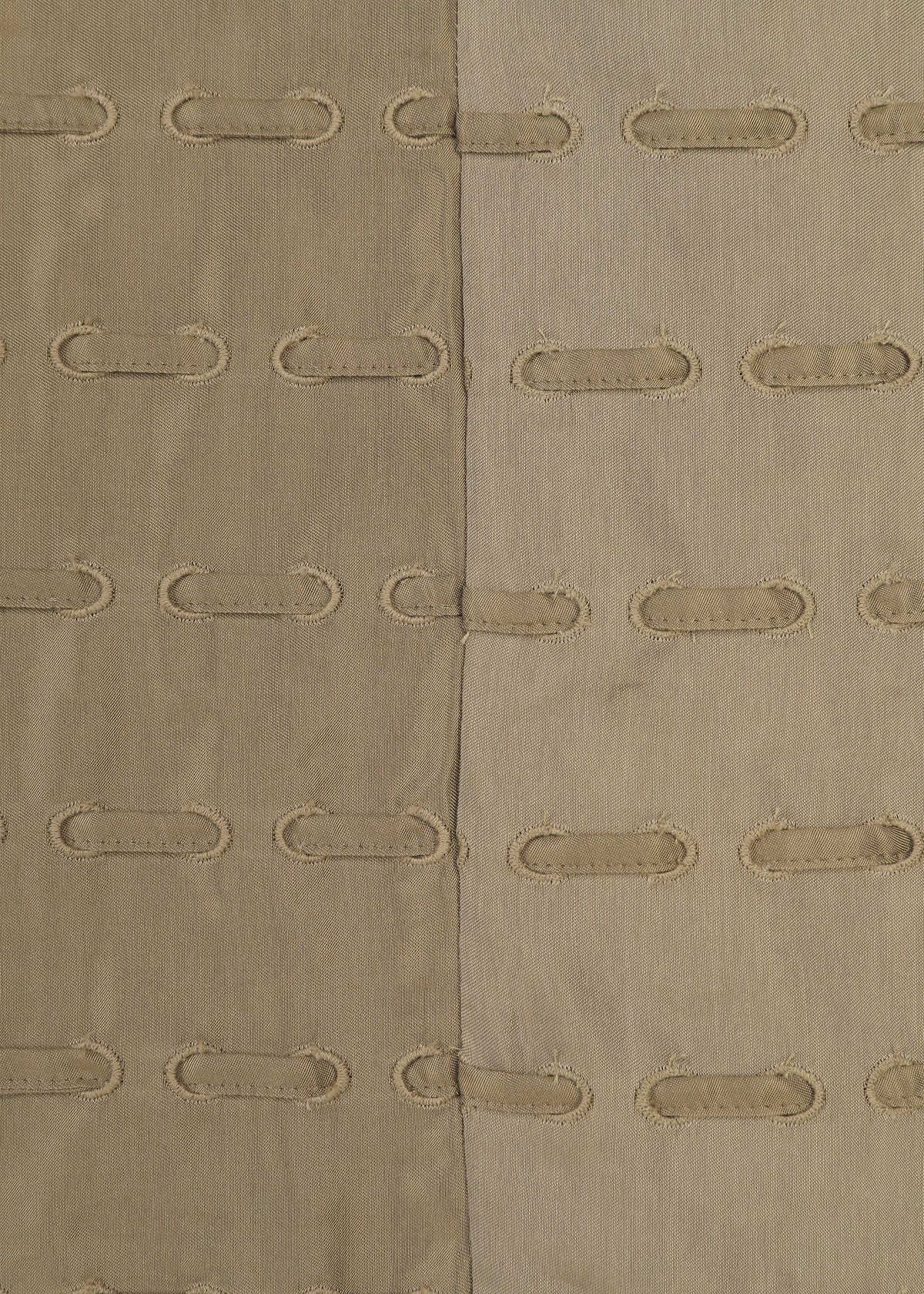 A detail shot of the HaaT HOLE & LINE cardigan.