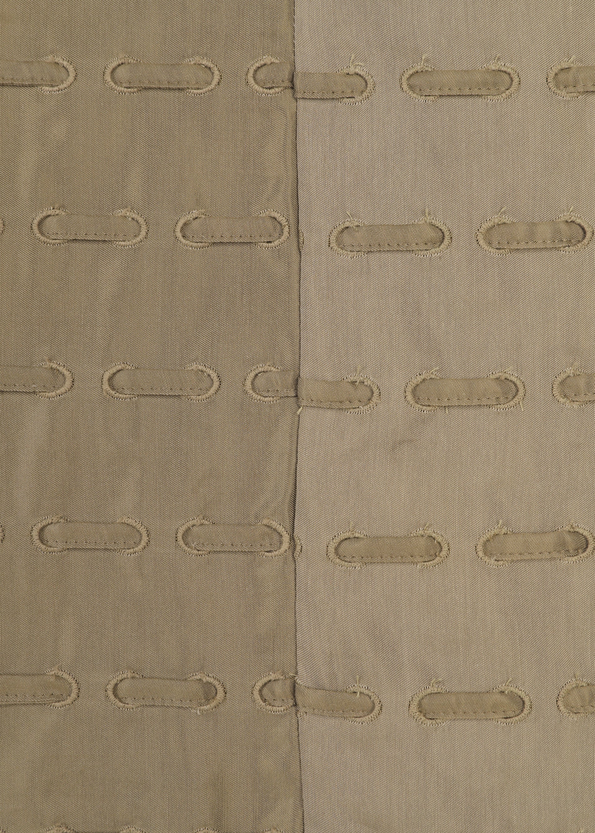 A detail shot of the HaaT HOLE & LINE cardigan.