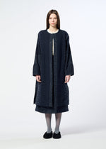 A model wears the HaaT COLLAGE STRETCH Ⅰ collage-stretch-i-top-navy.