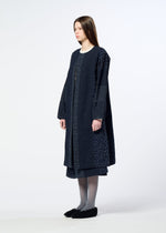 A model wears the HaaT COLLAGE STRETCH Ⅰ collage-stretch-i-top-navy.