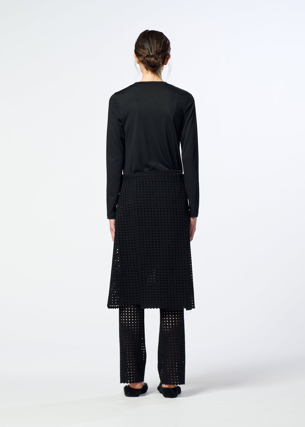 A model wears the HaaT LACY UNDER lacy-under-trousers-black.