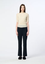 A model wears the HaaT KUMO SHIBORI KNIT SHEER top.