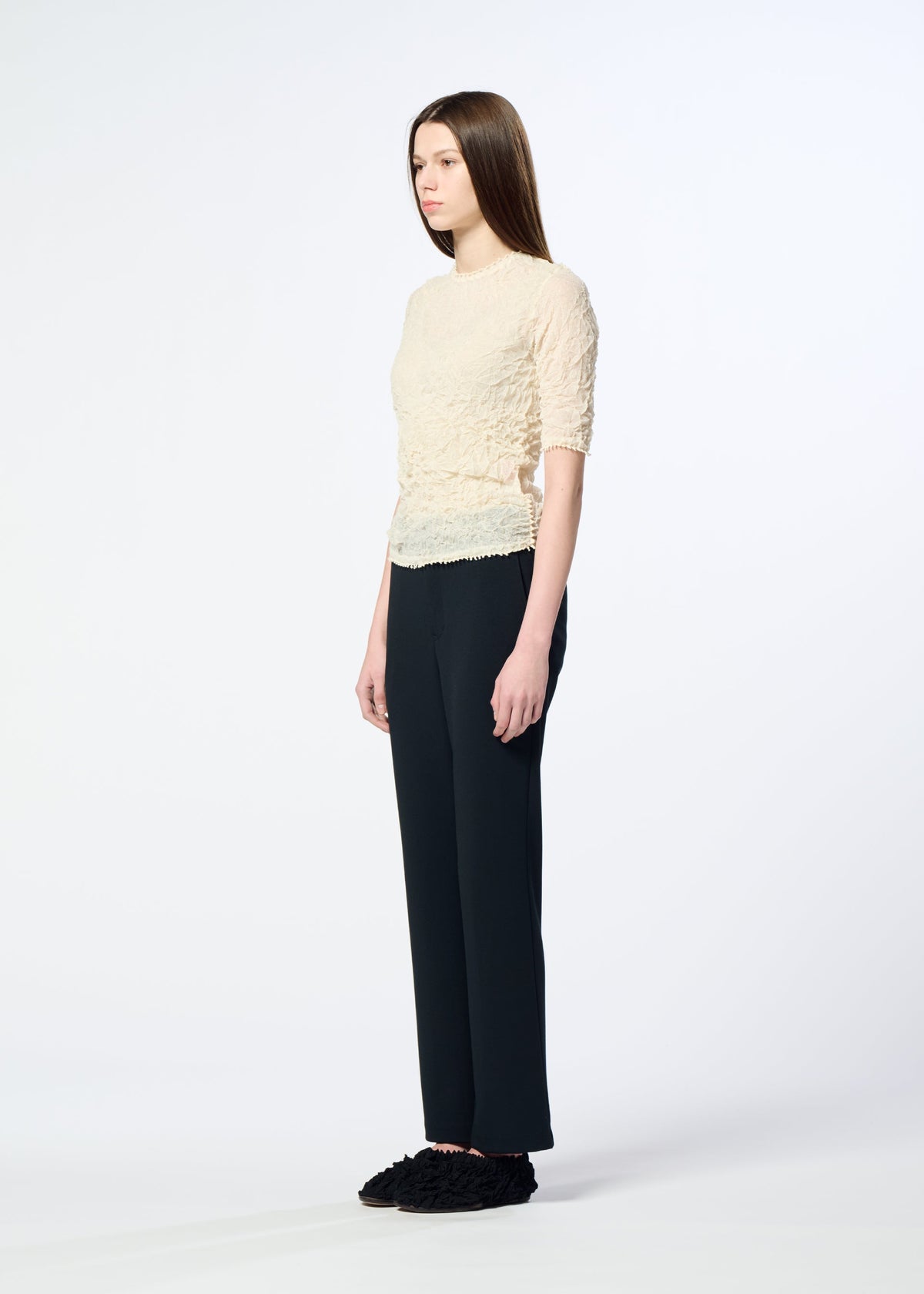 A model wears the HaaT KUMO SHIBORI KNIT SHEER top.
