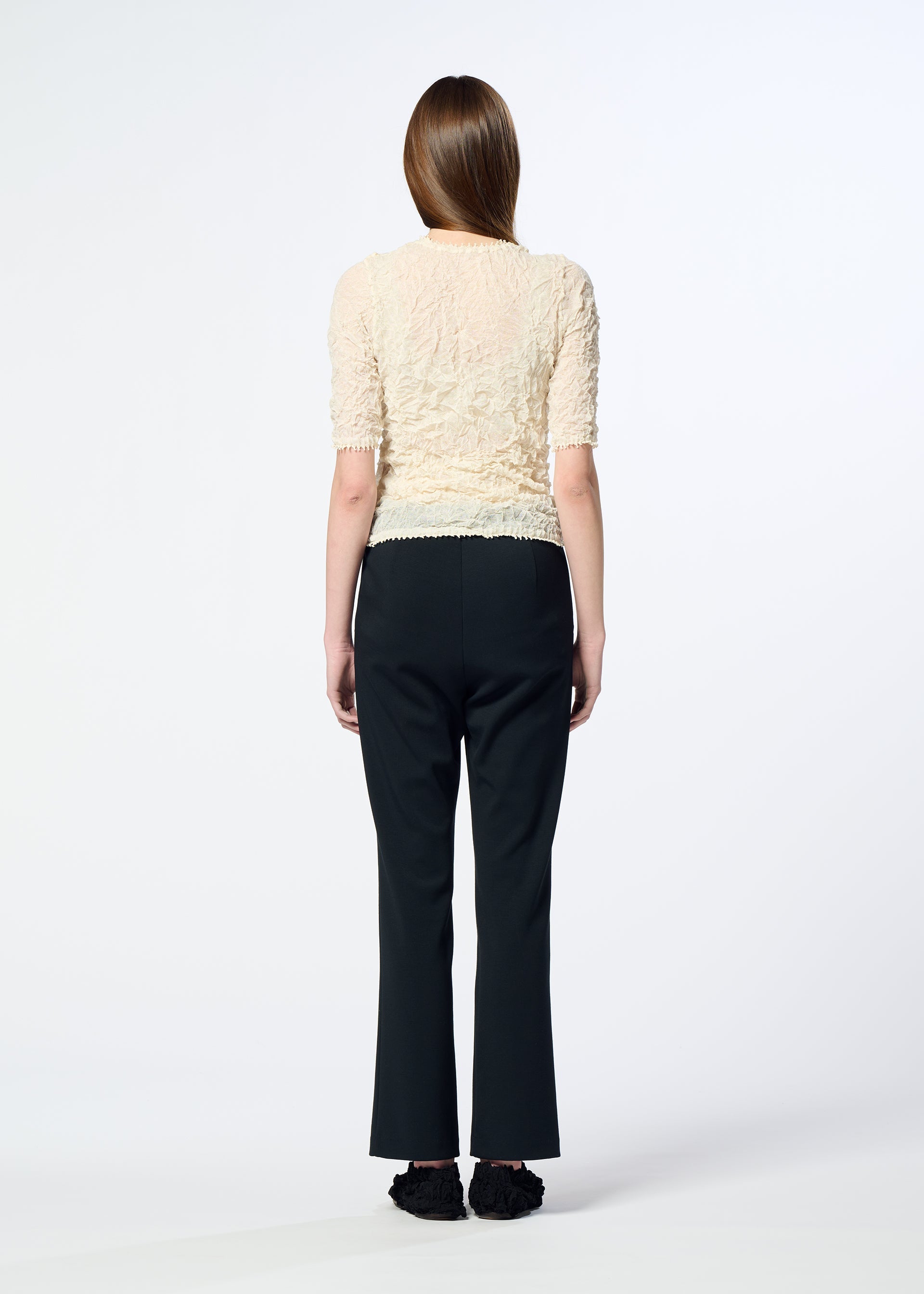 A model wears the HaaT KUMO SHIBORI KNIT SHEER top.