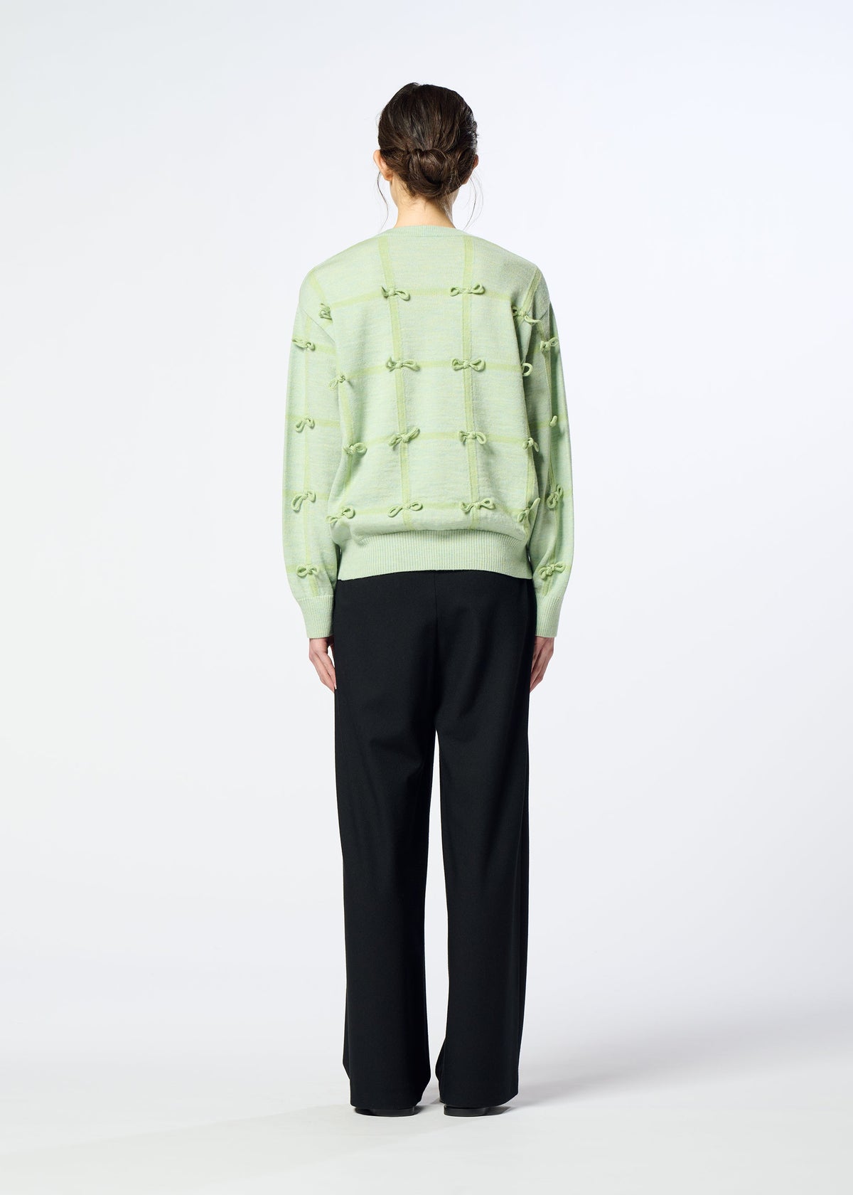 A model wears the HaaT RIBBON KNIT ribbon-knit-top-grey.