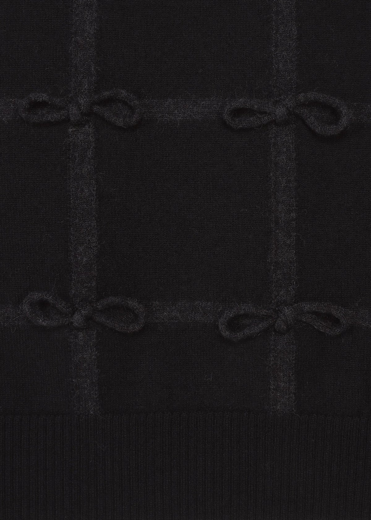 A detail shot of the HaaT RIBBON KNIT top.
