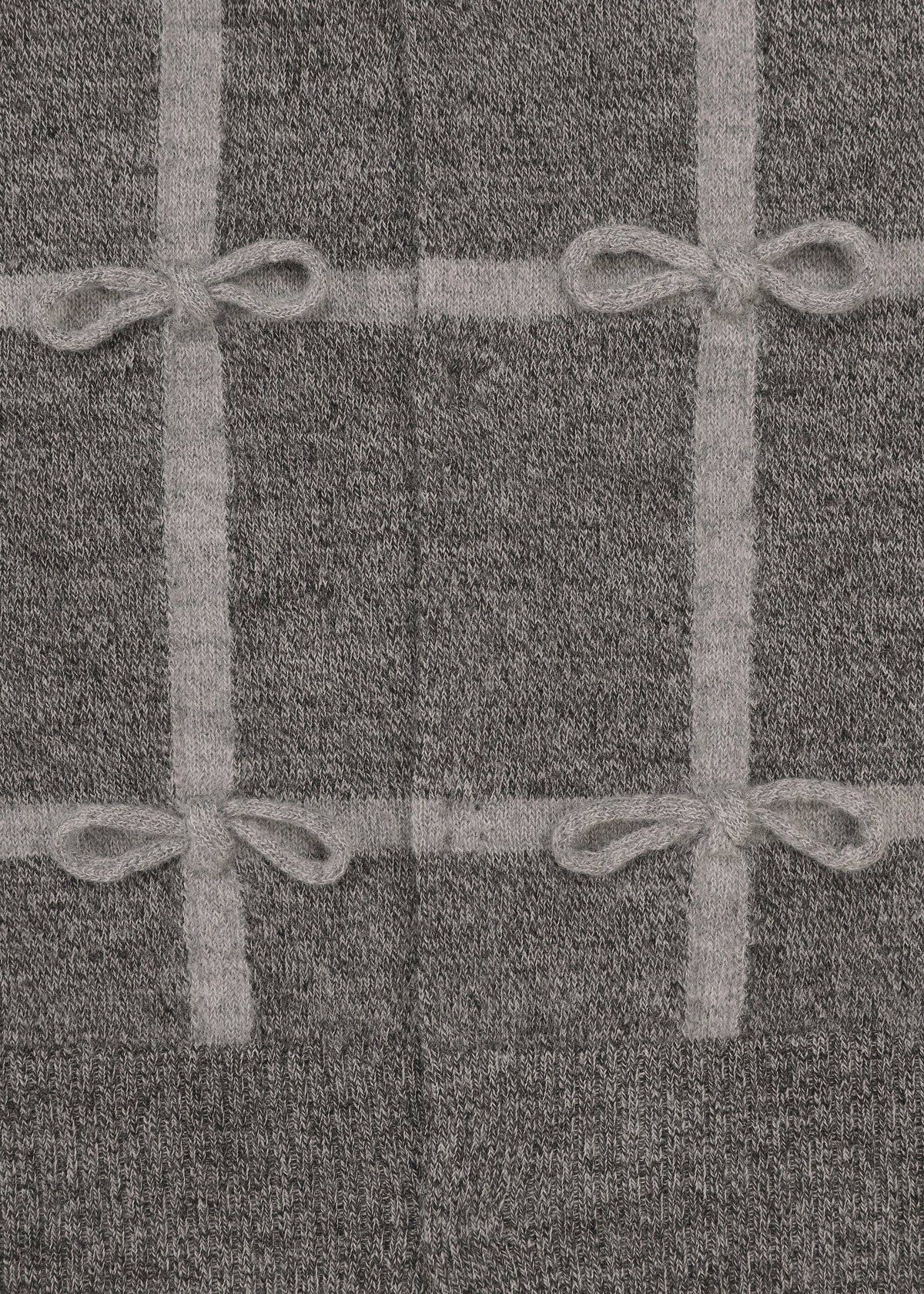 A detail shot of the HaaT RIBBON KNIT cardigan.