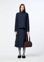 A model wears the HaaT BLOOM & PLAID BOSTON bloom-plaid-boston-handbag-almost-black.