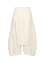 A product shot of the HaaT MULMUL BHILL trousers in ecru.