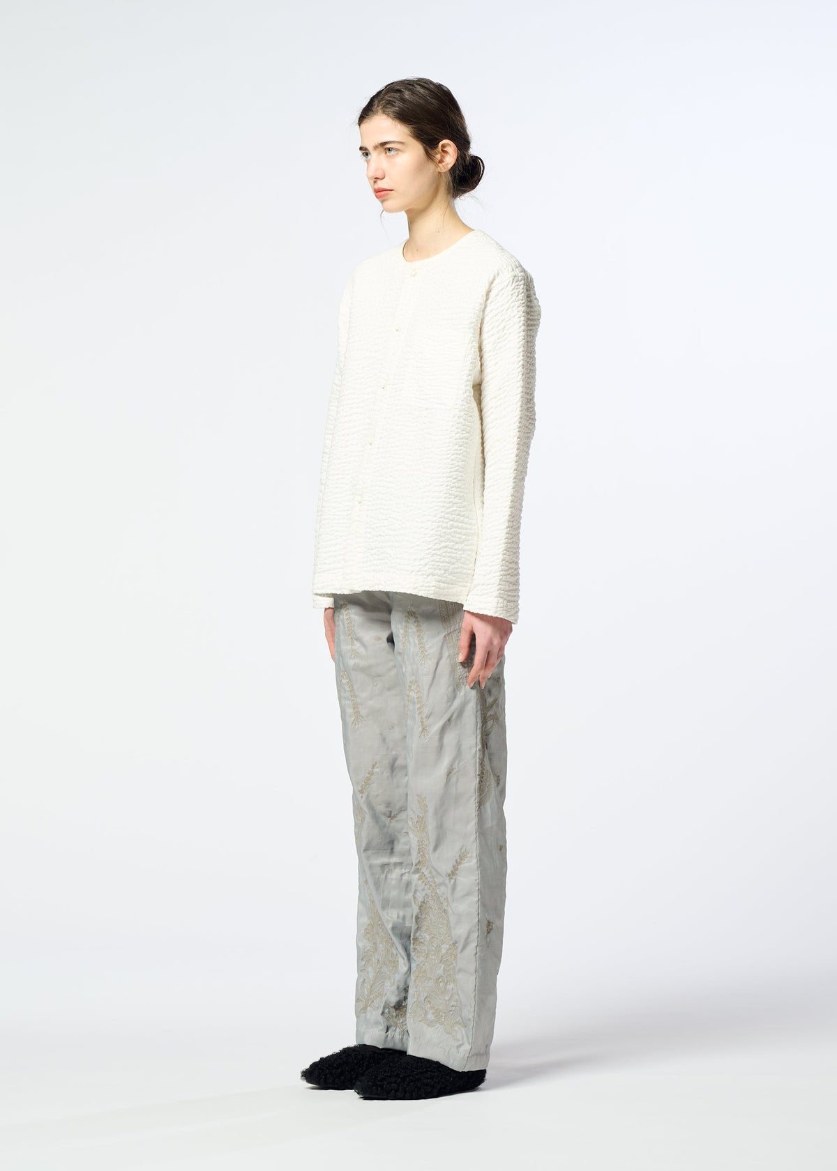A model wears the HaaT DELICATE FLORAL BHILL delicate-floral-bhill-trousers-almost-black.