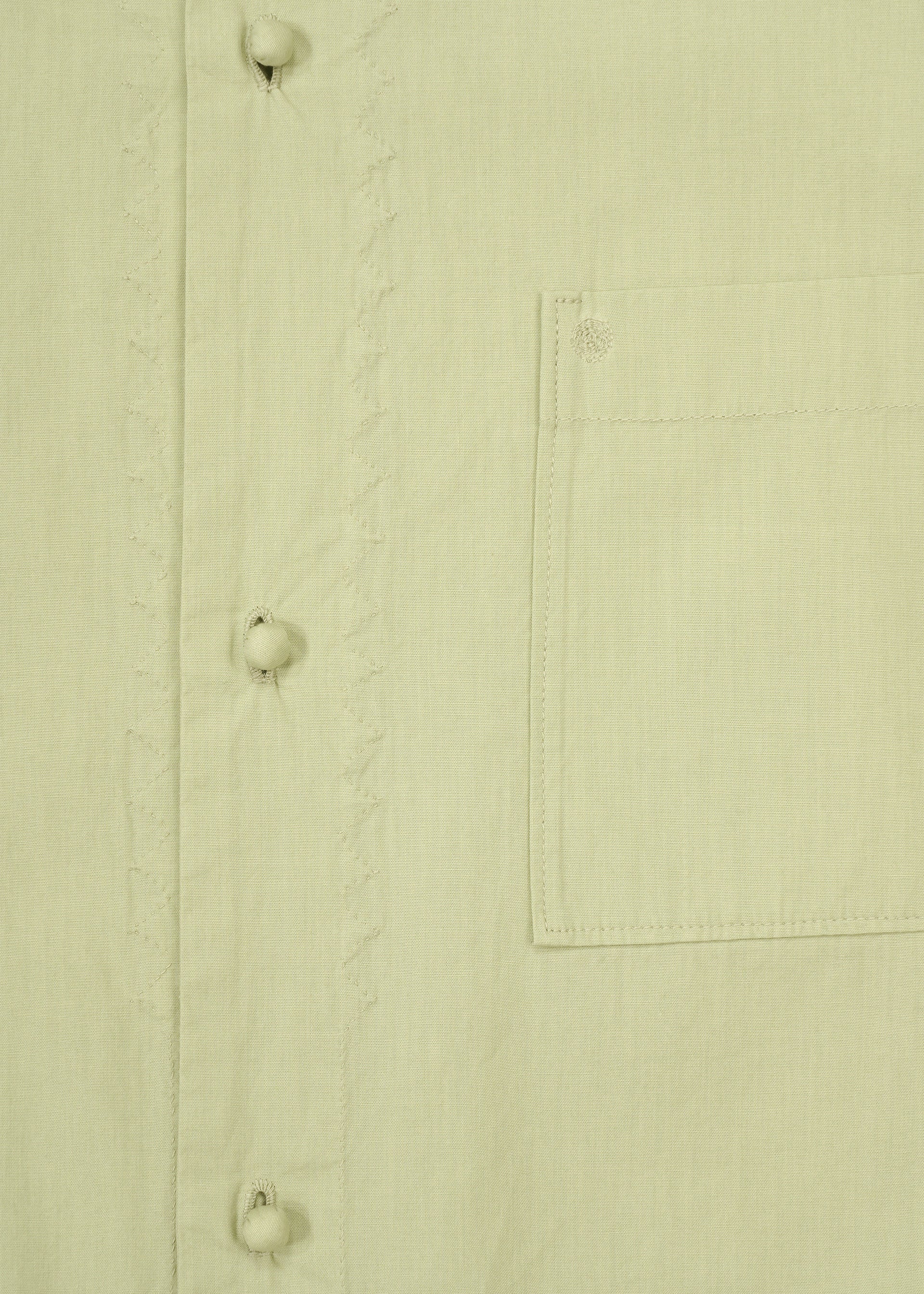 A detail shot of the HaaT KANGRI POCKET DOT shirt.
