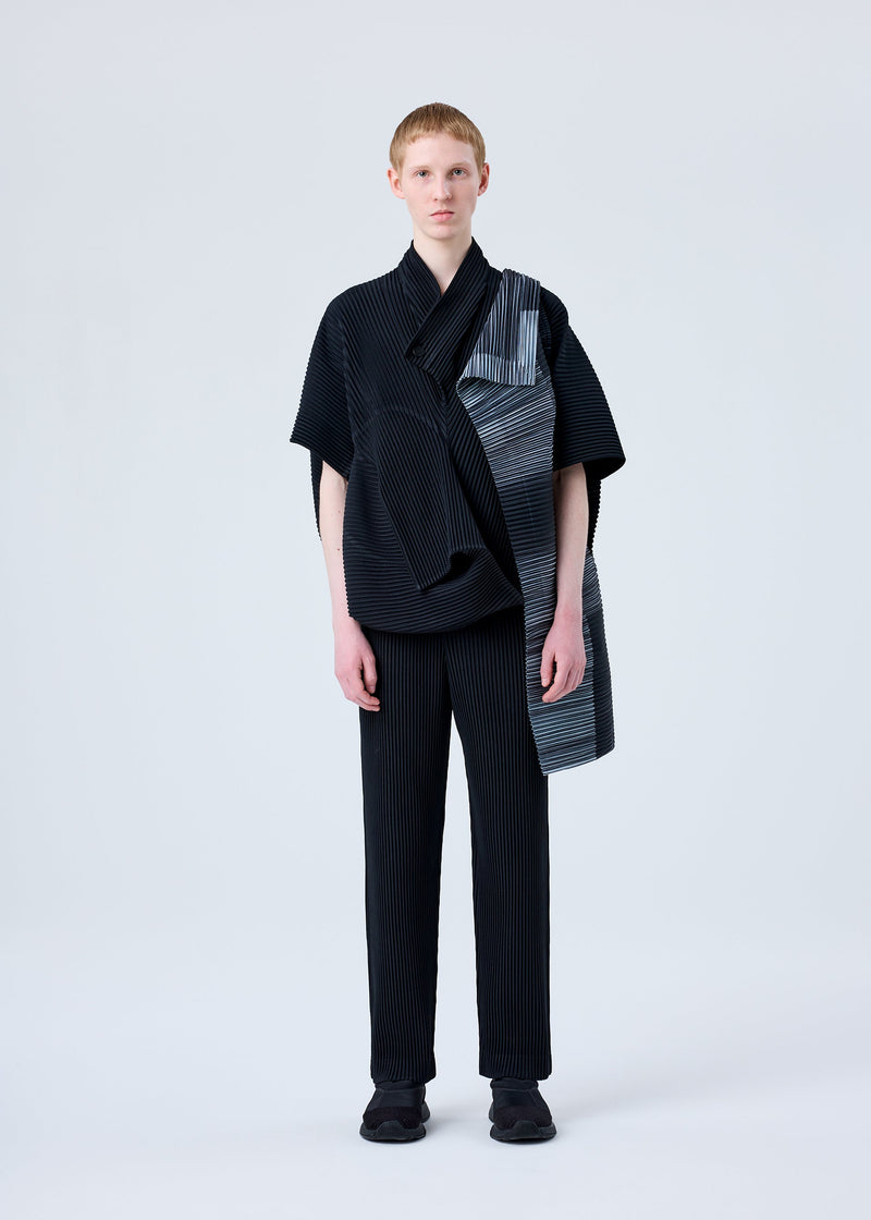 A model wears the HOMME PLISSÉ ISSEY MIYAKE RB_ALL OVER PLEATS BAG bag.