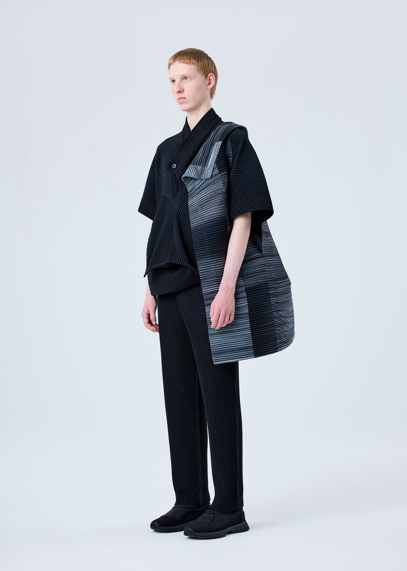 A model wears the HOMME PLISSÉ ISSEY MIYAKE RB_ALL OVER PLEATS BAG bag.