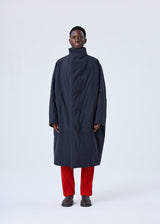 A model wears the HOMME PLISSÉ ISSEY MIYAKE BLANK DUVET COAT coat.