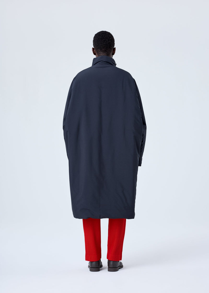 A model wears the HOMME PLISSÉ ISSEY MIYAKE BLANK DUVET COAT coat.