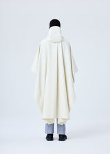 A model wears the HOMME PLISSÉ ISSEY MIYAKE RB_DRAWING COAT coat