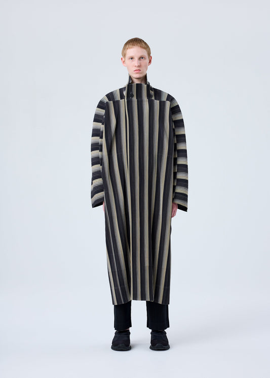 A model wears the HOMME PLISSÉ ISSEY MIYAKE RB_STRIPES 2 coat.