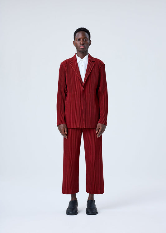 A model wears the HOMME PLISSÉ ISSEY MIYAKE TAILORED PLEATS 2 jacket.