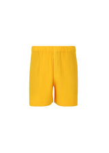 A product shot of the HOMME PLISSÉ ISSEY MIYAKE  MC JULY shorts in yellow (52)