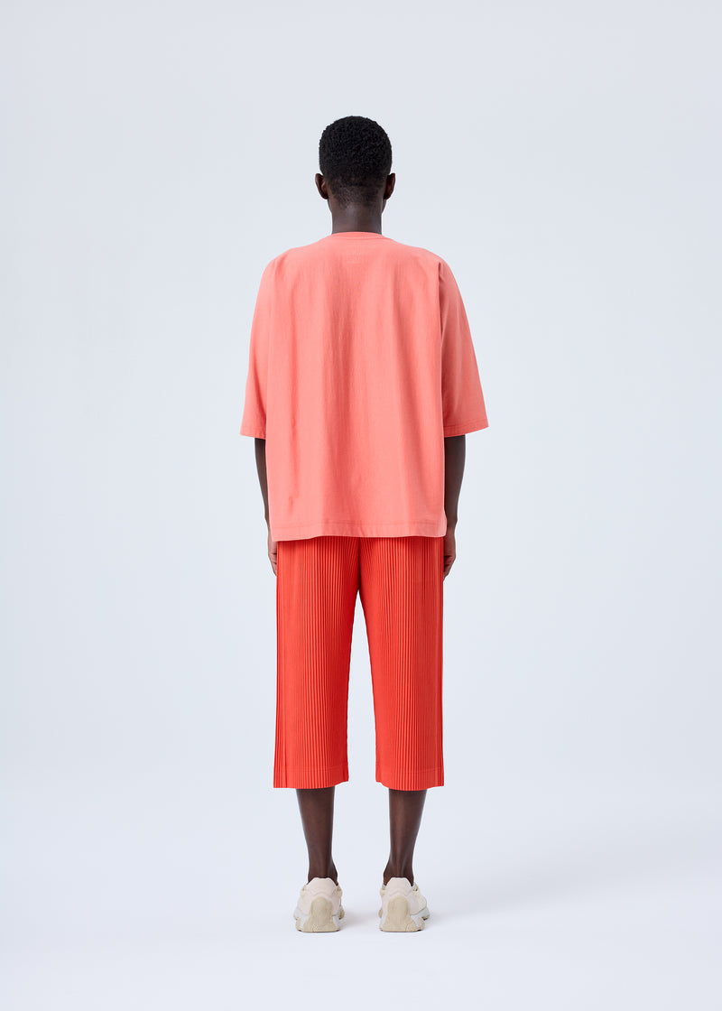 A model wears the HOMME PLISSÉ ISSEY MIYAKE  PLEATS BOTTOMS 1 trousers