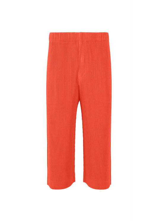 A product shot of the HOMME PLISSÉ ISSEY MIYAKE  PLEATS BOTTOMS 1 trousers in salmon red (27)