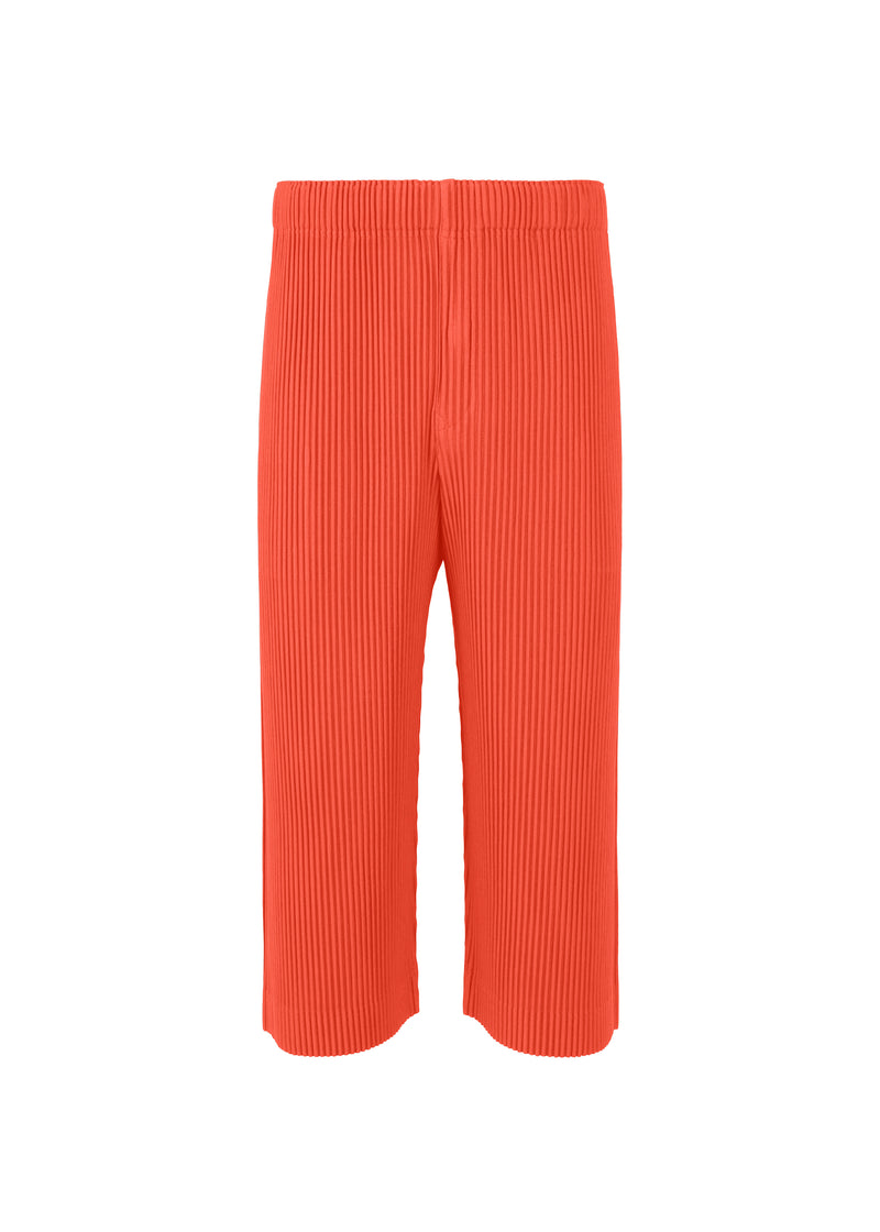 A product shot of the HOMME PLISSÉ ISSEY MIYAKE  PLEATS BOTTOMS 1 trousers in salmon red (27)