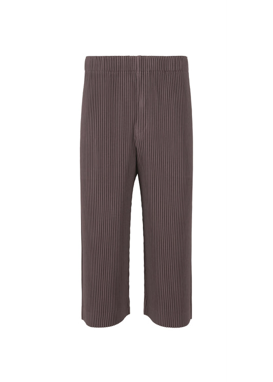 A product shot of the HOMME PLISSÉ ISSEY MIYAKE  PLEATS BOTTOMS 1 trousers in slate violet (83)