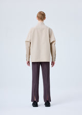 A model wears the HOMME PLISSÉ ISSEY MIYAKE  PLEATS BOTTOMS 1 trousers